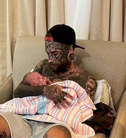 A 24-year-old father, who has several tattoos all over his body..